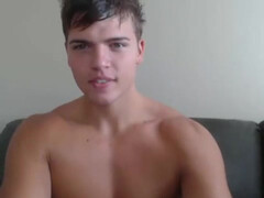 Красивый паренек ласкает половой член лежа на диване